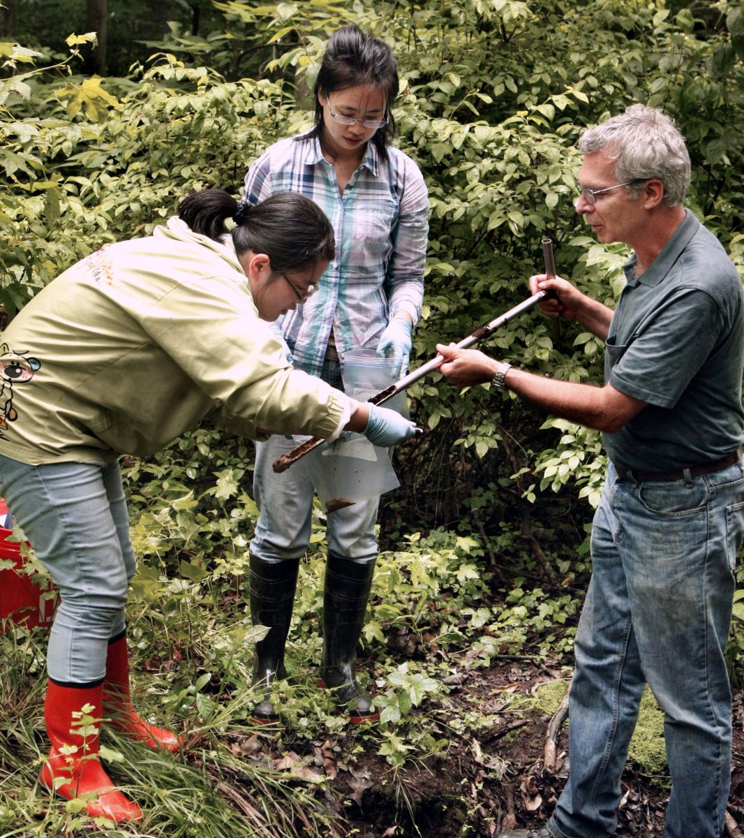 Professor Peter Jaffe (right) discovered a soil bacterium that could help clean contamination from groundwater. Here Jaffe and colleagues collect soil samples from the Assunpink Wildlife Management Area in New Jersey where the bacterium was originally discovered. (Photo by Frank Wojciechowski)