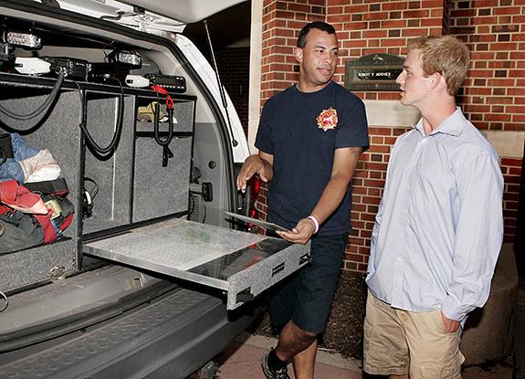 Town Princeton Fire Chief Dan Tomalin and Jacobson discuss ways to better use data at fires. The FireStop team is working with the town fire department while developing the software. (Photo by Frank Wojciechowski)