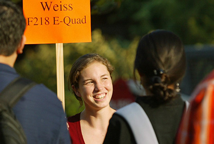 Rachel Rosenthal, a junior majoring chemical engineering, gathers freshman who were about to meet with their advisor, Ron Weiss, associate professor electrical engineering. (Photo by Frank Wojciechowski) Rachel Rosenthal gathers freshman