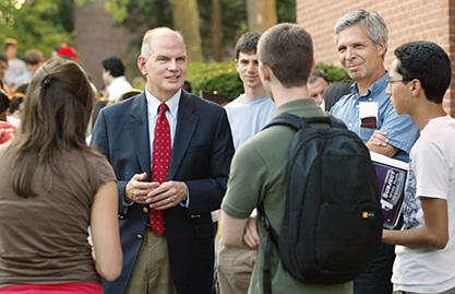 Dean of Engineering H. Vincent Poor (center) speaks with freshman after their orientation meeting. Peter Jaffe (right), professor of civil and environmental engineering, joins in the conversation. (Photo by Frank Wojciechowski) Dean H. Vincent Poor talks with freshman
