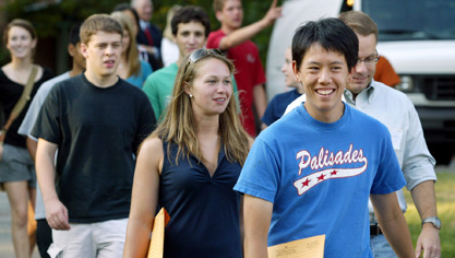Brandon Szeto, a senior majoring in chemical engineering, led freshman from a welcoming meeting to their first small-group meetings with their faculty advisors. Mikko Haataja, assistant professor of mechanical and aerospace engineering (right) walks with group. (Photo by Frank Wojciechowski) Mikko Haataja with members of Class of 2012