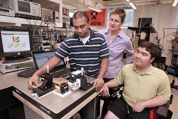A new system developed by Princeton researchers uses a laser to allow diabetics to check their blood sugar without pricking their skin. Members of the research team included, from left, Sabbir Liakat, a graduate student in electrical engineering; Claire Gmachl, the Eugene Higgins Professor of Electrical Engineering; and Kevin Bors, who graduated in 2013 with a degree in electrical engineering. (Photos by Frank Wojciechowski)